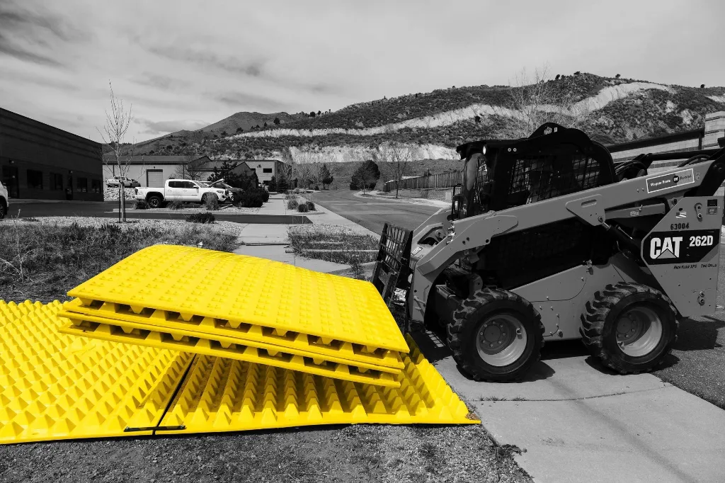 fods-trackout-control-mats-installed-using-skid-steer-reusable-construction-entrance-exit-tc-1-vehicle-trackout-controls-bmp-1.webp