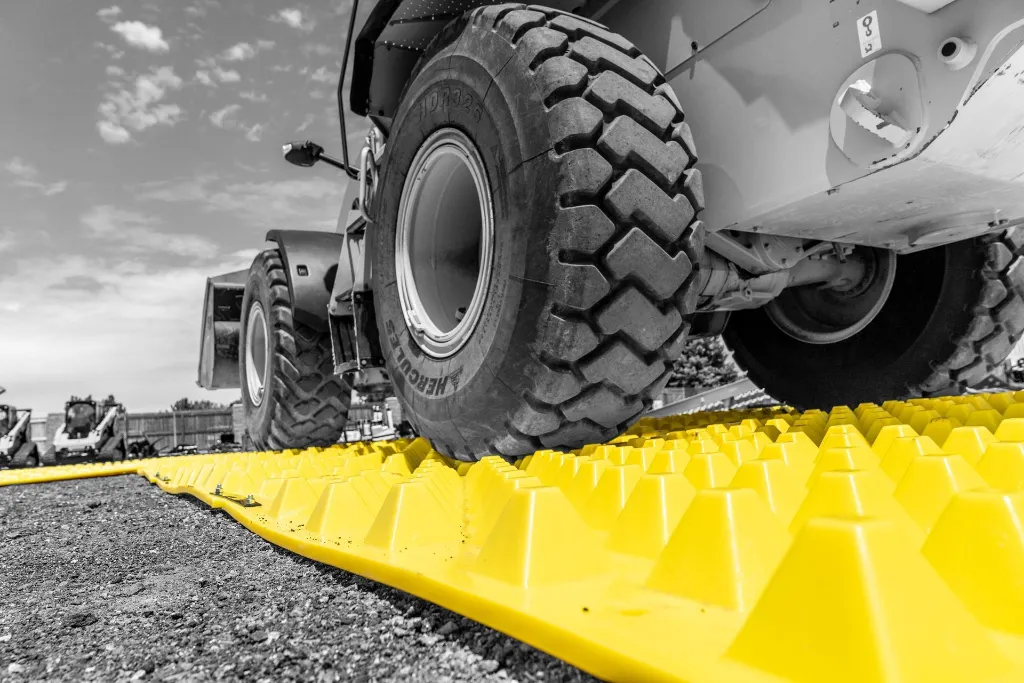 fods-trackout-control-mats-with-vehicle-driving-over-reusable-construction-entrance-exit-tc-1-vehicle-trackout-controls-bmp.webp